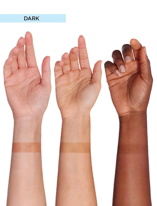 Three raised arms of different skin tones, bronzed with BondiSandsEU Self Tanning Foam Dark, display two horizontal swatches each on forearms against a white background. "DARK" is shown in a light blue box at the top left.