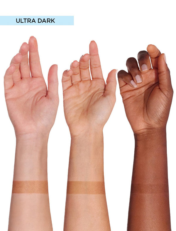 Three forearms of varying skin tones display swatches of BondiSandsEU Self Tanning Foam Ultra Dark, each arm featuring a horizontal band of the brand’s deepest Australian tan shade.