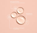 Three clear drops of BondiSandsEU's Wonder Potion Hero Oil on a peach background, labeled with sea buckthorn to brighten, rosehip oil to nourish, and calendula extract to soothe—each shown with a matching line drawing icon.