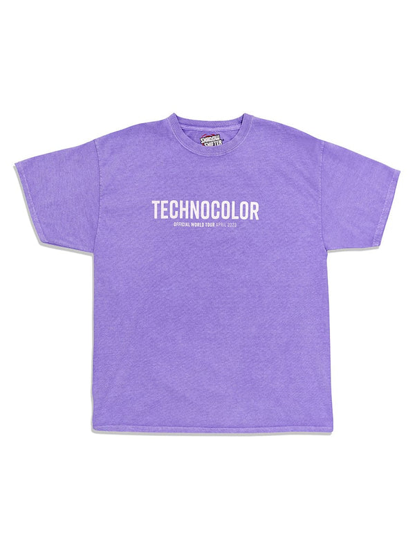 The BondiSandsEU Technocolor Technoverse Tee is an oversized purple shirt featuring "TECHNOCOLOR" in bold white letters and "OFFICIAL WORLD TOUR APRIL 2023" on the chest, shown against a white background.