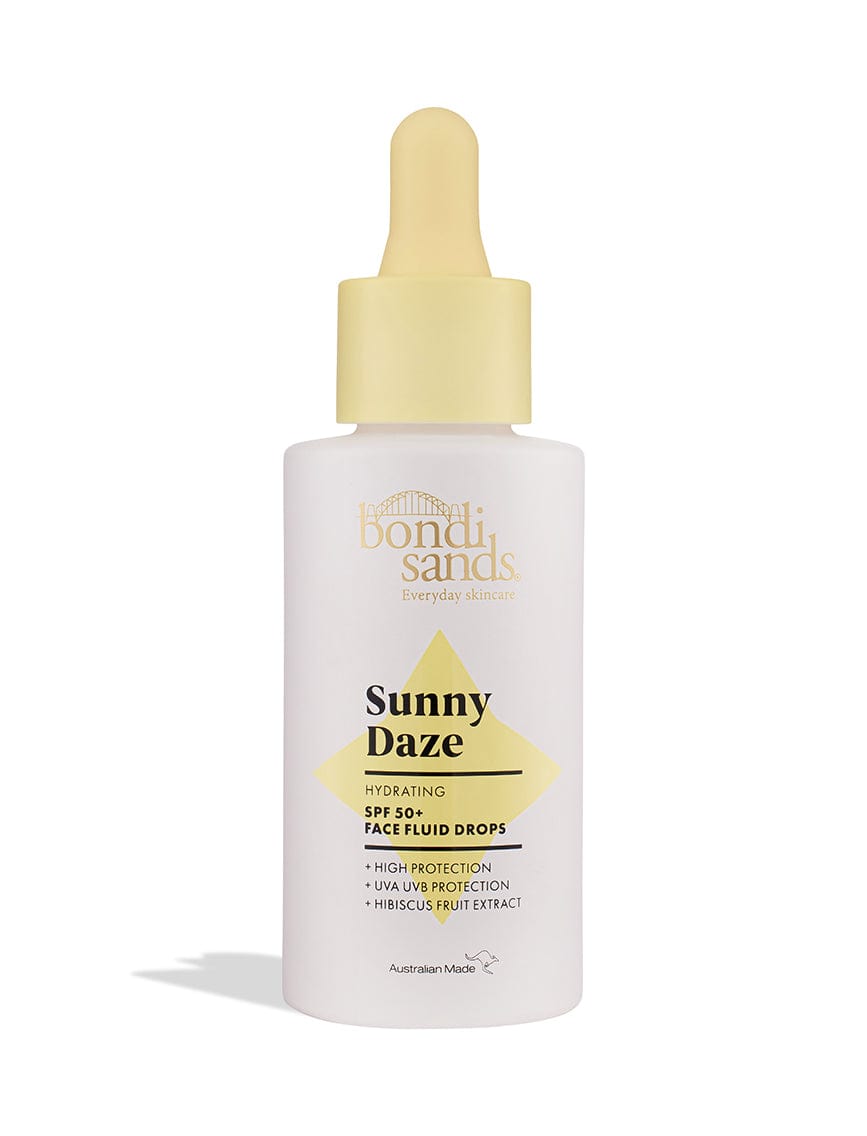 A white bottle with a yellow dropper labeled BondiSandsEU Sunny Daze Hydrating SPF 50+ Face Fluid Drops delivers high UVA/UVB protection as a hydrating sunscreen, enriched with hibiscus fruit extract.