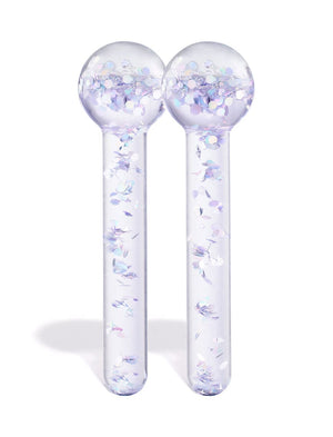The BondiSandsEU De Puff Cooling Facial Globes—two clear glass globes with round tops and iridescent confetti—stand upright side by side against a white background, ideal for reducing puffiness and boosting lymphatic drainage.