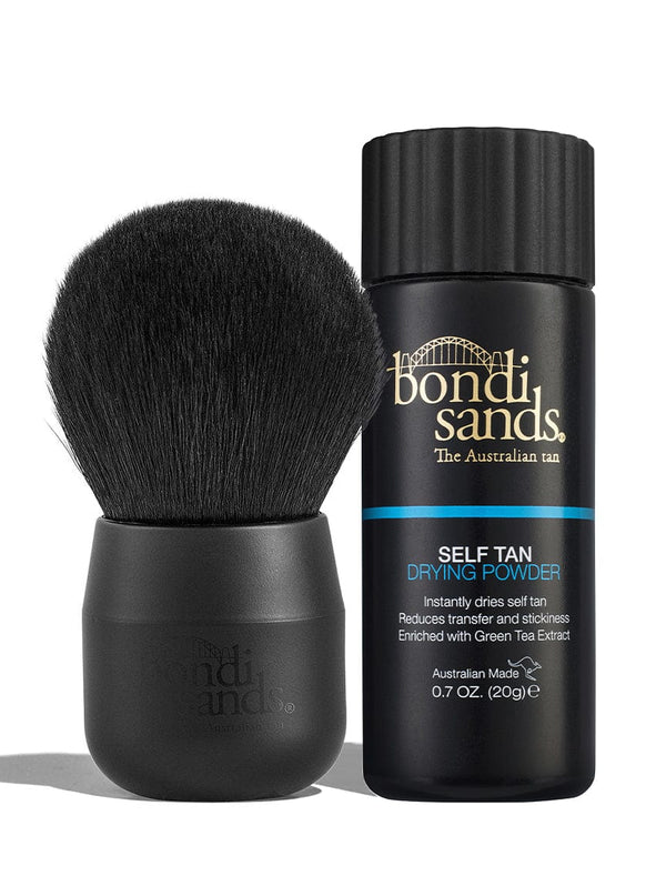 The BondiSandsEU Self Tan Drying Powder & Brush Bundle features a sleek black brush and a bottle with gold and blue accents, standing upright against a white background—ideal for a flawless tan.
