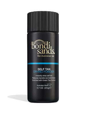 A black cylindrical bottle of BondiSandsEU Self Tan Drying Powder & Brush Bundle features gold and white text, a ribbed black cap, and highlights quick drying, green tea extract, and achieving a flawless tan.