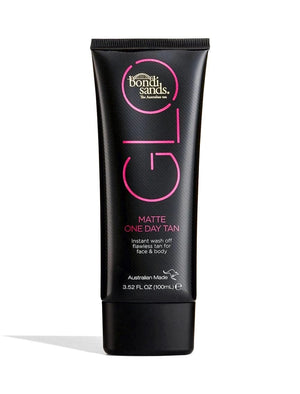 A black tube from BondiSandsEU's Bondi Sands X Carli Bybel Bundle, labeled for instant wash-off flawless tan for face and body. The tube contains 3.52 fl oz (100 mL) and features pink and white text.