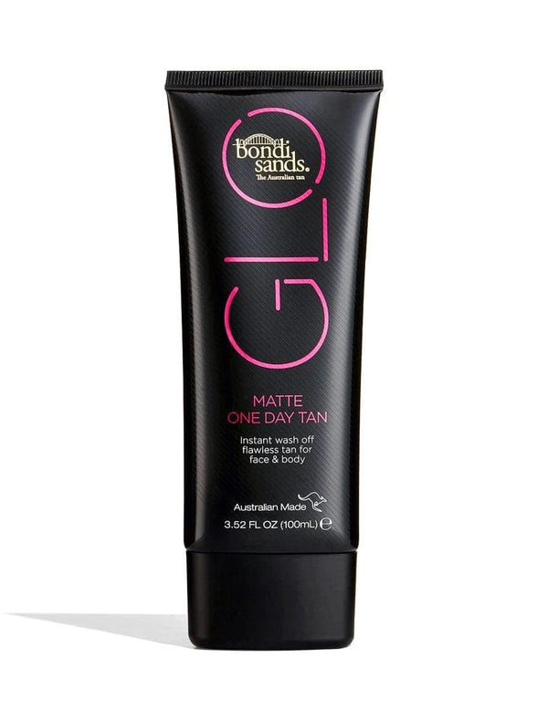 A black tube from BondiSandsEU's Bondi Sands X Carli Bybel Bundle, labeled for instant wash-off flawless tan for face and body. The tube contains 3.52 fl oz (100 mL) and features pink and white text.