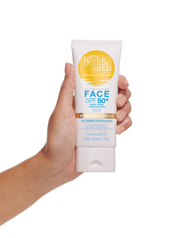 A hand holds a 75 ml tube of BondiSandsEU SPF 50+ Everyday Face Sunscreen Lotion, a water resistant daily moisturizer in a white tube with yellow and blue text for high sun protection.