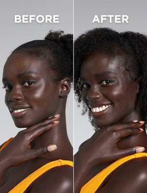 Side-by-side photos of a smiling woman with a natural tan for deep skin tones wear an orange top, hair pulled back on the left and loose curls on the right, both showing her hand glowing with BondiSandsEU Technocolor Caramel Self Tanning Face Serum.