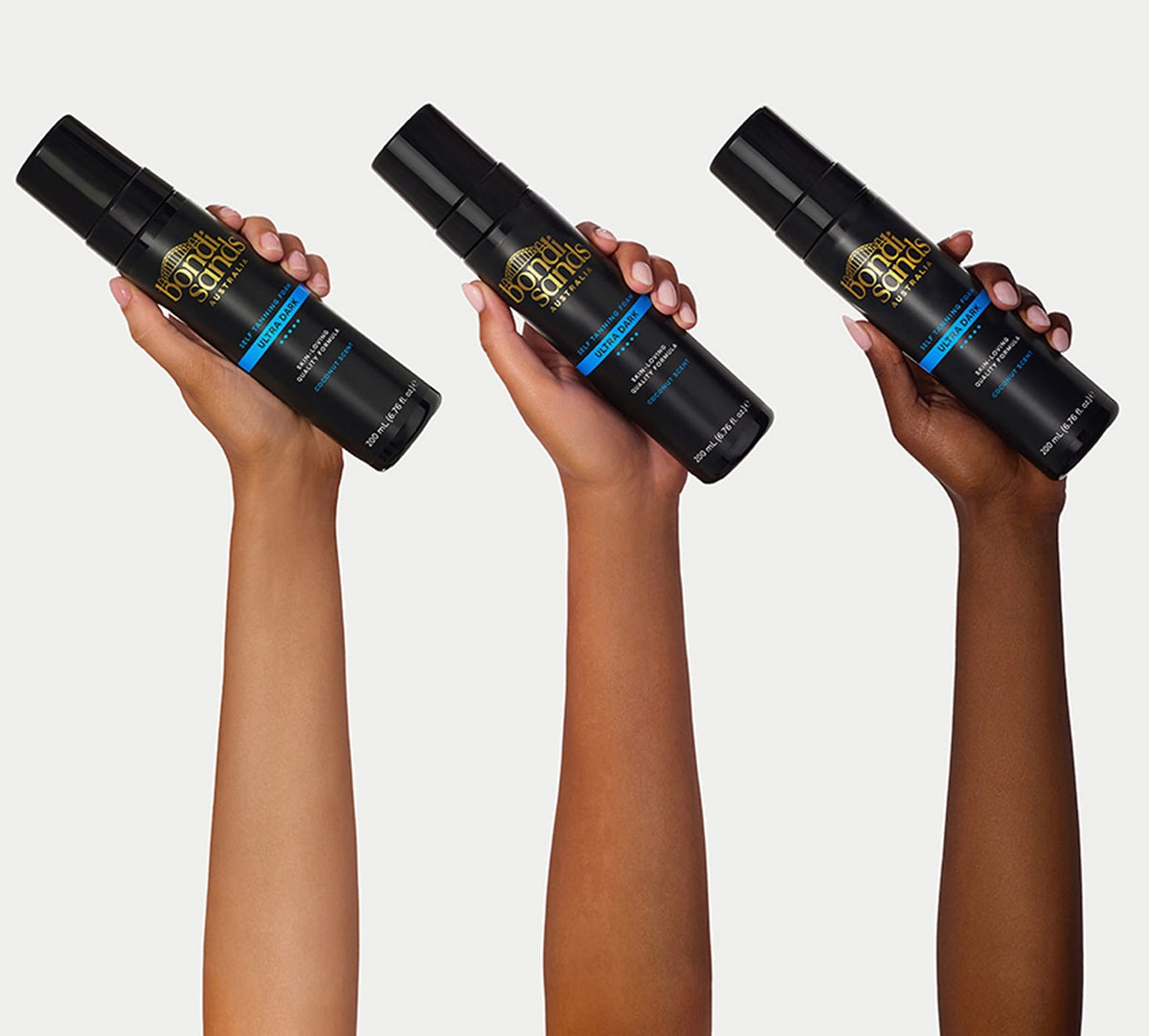 Three hands with varied skin tones hold the BondiSandsEU Ultra Dark Self Tanning Routine Bundle's black bottle, featuring blue accents and branding—a perfect match for an application mitt to achieve flawless results against a white background.