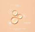 Clear serum droplets on a peach background highlight three brightening ingredients—Vitamin C, Kakadu Plum, and Liquorice Root Extract—in BondiSandsEU's Gold'n Hour Vitamin C Serum to visibly brighten skin.