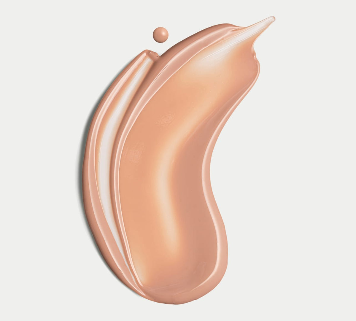 A smooth, creamy swipe of BondiSandsEU Face SPF 50+ Tinted Everyday Sunscreen Fluid with a dewy finish on a white background, and a small drop of the same product near the top edge of the streak.