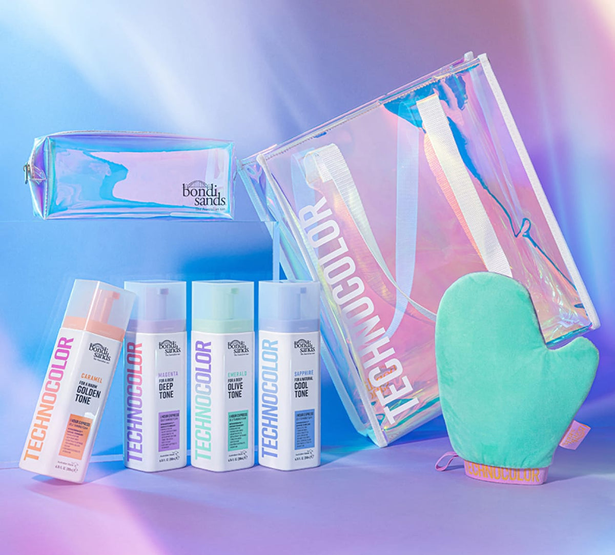 Iridescent cosmetic bag and transparent TECHNICOLOR tote shown with four BondiSandsEU Caramel Technocolor 1 Hour Express Self Tanning Foams and a mint green tanning mitt, all set against a pastel gradient background.