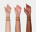 Three raised arms with varied skin tones, each showing two brown swatches—evoking the sun-kissed radiance of BondiSandsEU Express Self Tanning Bundle—set against a plain white background.