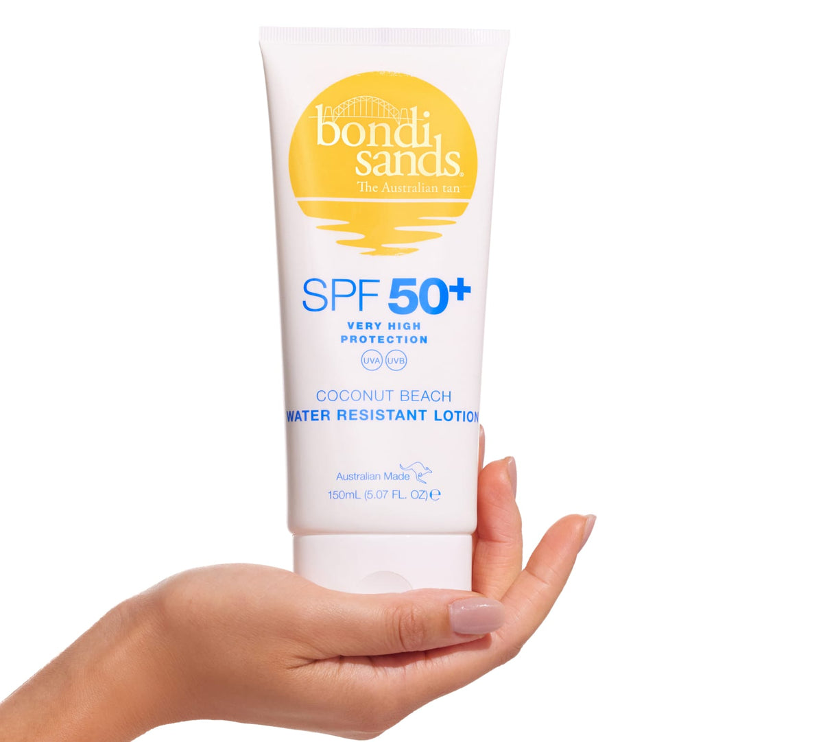 A hand holds a 150ml tube of BondiSandsEU SPF 50+ Body Sunscreen Lotion Coconut Beach Scent, with yellow and blue text on white. This broad-spectrum, water-resistant lotion delivers very high UV protection.