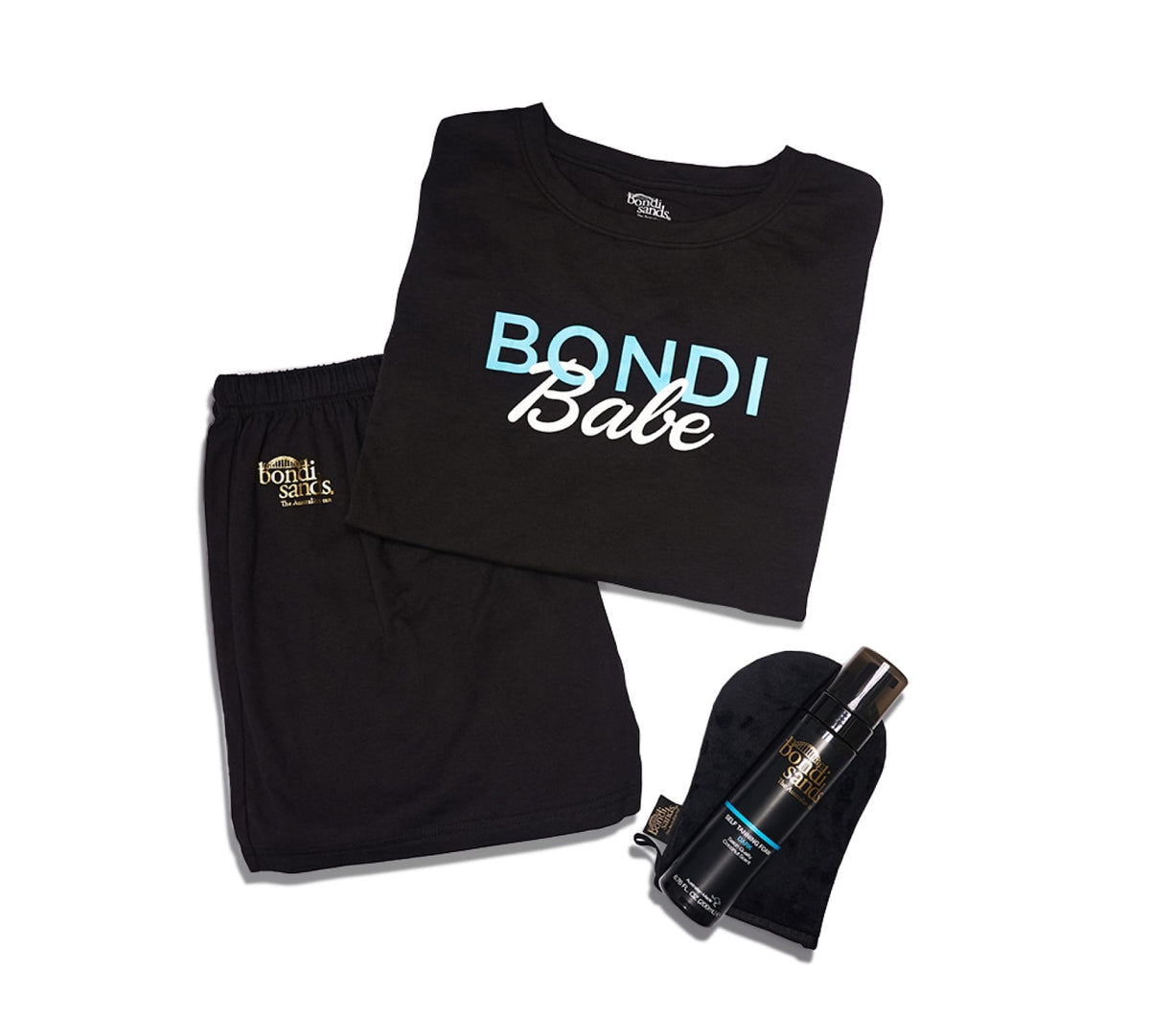 The BondiSandsEU Bondi Babe Short Tanning PJs set includes folded black pyjamas with "Bondi Babe" in blue and white, matching shorts, a Bondi Sands self tanning foam bottle, and a black tanning mitt, all on a white background.