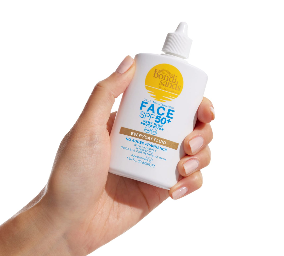 A hand holds a white bottle of BondiSandsEU SPF 50+ Fragrance Free Face Fluid, specially designed for sensitive skin. Its precise nozzle cap makes it ideal for daily sun protection.