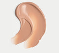 A creamy swipe of BondiSandsEU SPF 50+ Everyday Hydrating Tinted Face Lotion in beige is spread in a curved line on a white background, providing high sun protection for your face.