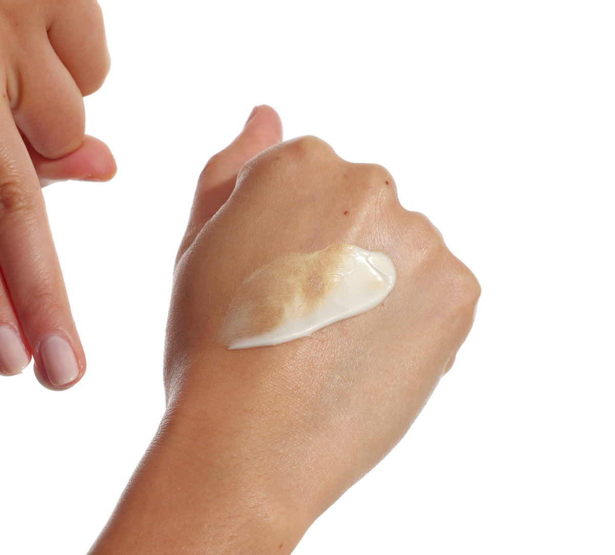 A close-up shows Skin Illuminator Gradual Tanning Lotion by BondiSandsEU being applied to skin, with one hand ready to spread the tan on the back of the other, all set against a white background for a naturally glowing look.