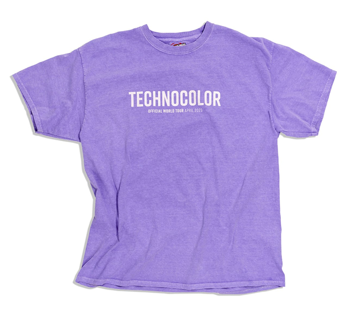 The BondiSandsEU Technocolor Technoverse Tee is an oversized purple shirt featuring "TECHNOCOLOR" and "OFFICIAL WORLD TOUR APRIL 2023" in white on the front, displayed flat against a white background.