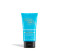 A blue tube from the BondiSandsEU Starter Bundle stands upright on a white background, labeled as a body moisturizer with dual action formula and cocoa butter scent for gentle gradual tanning milk benefits.