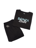 BondiSandsEU Bondi Babe Short Tanning PJs feature a black "Bondi Babe" tee with blue and white text and matching shorts with the Bondi Sands logo, both displayed on a crisp white background.