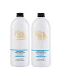 The BondiSandsEU Light-Medium Salon Solution 1L Duo features two white bottles with black caps and blue labels. Achieve a flawless, bronzed glow in just 2 hours with this professional light/medium spray tan formula.