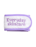 The BondiSandsEU Everyday Skincare Headband is a soft white and lavender accessory with "Everyday skincare" embroidered in purple, perfect for wearing during your skincare routine.