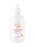 A white pump bottle of BondiSandsEU Tropical Rum Body Wash, self tan friendly and pH balancing, with a tropical rum scent. The label shows gold and pink text, the Bondi Sands logo, and reads “The Australian Tan.”.