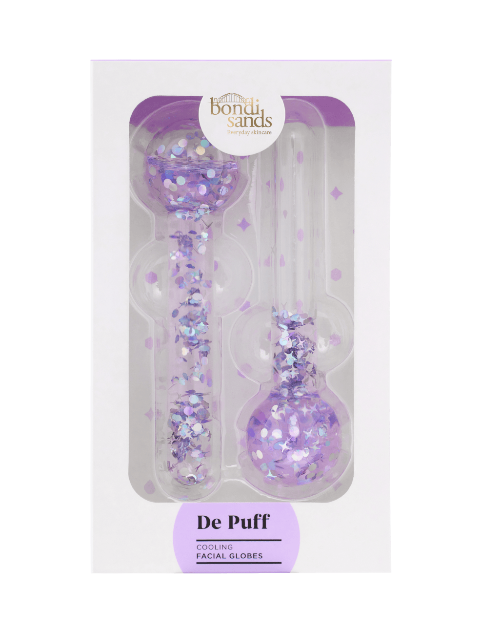 Two clear, round-ended De Puff Cooling Facial Globes by BondiSandsEU, filled with purple glitter confetti, come in a white and purple box—ideal for de-puffing and boosting lymphatic drainage.