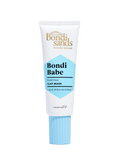 A white and blue tube of BondiSandsEU Bondi Babe Clay Mask, formulated to detoxify skin and reveal a glowing complexion with blue spirulina extract, featuring a ribbed blue cap and gold and blue text on the label.