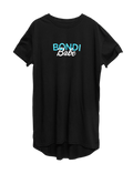 The Bondi Babe Self Tanning Tee by BondiSandsEU is a black short-sleeved shirt featuring “BONDI Babe” printed in turquoise and white text on the front. Designed with a slightly rounded hem, it’s the perfect tee for any Bondi Babe eager to show off their glow.