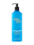A 12.68 fl oz (375 mL) blue pump bottle of BondiSandsEU Gradual Self Tanning Milk, a body moisturizer scented with cocoa butter that hydrates skin for a daily glow.