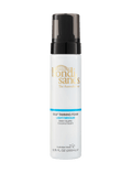 A white bottle of BondiSandsEU Light-Medium Self Tanning Foam with a black pump dispenser. The label indicates its light/medium shade, coconut scent, and salon-quality formula. This self-tanning foam is crafted to deliver a natural glow and flawless finish. Bottle size: 6.76 fl oz (200 mL).