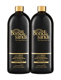 Two black bottles of BondiSandsEU Liquid Gold Salon Solution Bundle, each 1 liter with gold text and accents. This professional spray tan solution is infused with argan oil and provides a radiant, golden glow in just 2 hours for salon-quality results.
