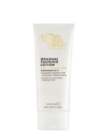 A 150mL white tube of BondiSandsEU Skin Illuminator Gradual Tanning Lotion features gold text and is designed to deliver glowing skin with a gradual, natural-looking tan and radiant finish.