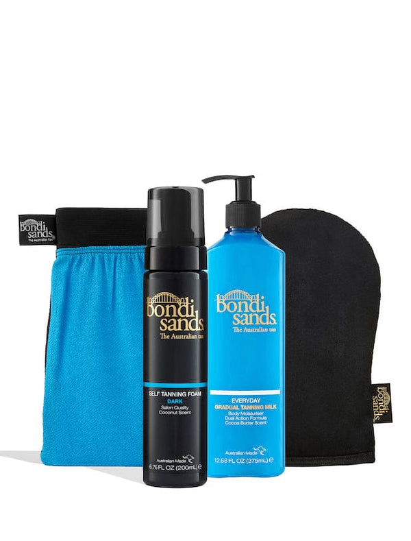 The BondiSandsEU Dark Self Tanning Routine Bundle, featuring a mitt, self tanning foam, and gradual tanning milk with pump, is displayed against a white background for the perfect at-home tan.