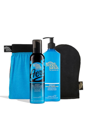 The BondiSandsEU Aero 1 Hour Express Self Tanning Routine Bundle includes a blue mitt, pouch, black and blue self tanning foam, and blue gradual tanning milk—everything for your perfect glow, all shown on a white background.