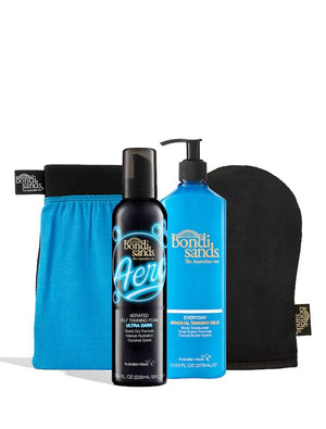 The BondiSandsEU Aero Ultra Dark Self Tanning Routine Bundle features a blue tanning mitt, black applying mitt, self tanning foam, and a blue bottle of gradual tanning milk—all essentials for your flawless self-tan on a clean white background.