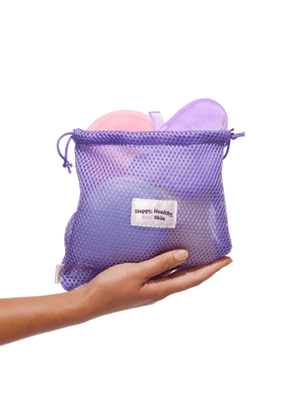 Bondi Sands Squeaky Clean Reusable Makeup Pads in a Purple Mesh Bag Handheld