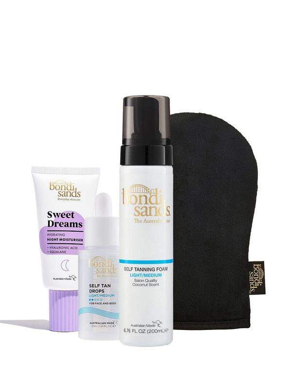 The BondiSandsEU Glow Head to Toe Bundle includes self tan drops, self tanning foam, Sweet Dreams night moisturiser, and a black tanning mitt, all upright against a white background.