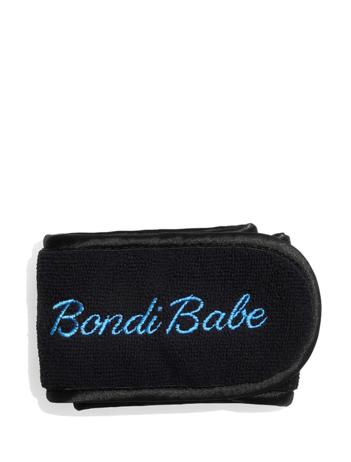 The Bondi Babe Headband by Bondi Sands Europe is a black terry cloth headband with "Bondi Babe" embroidered in light blue cursive, designed for hair protection. It features a velcro closure and appears against a white background.