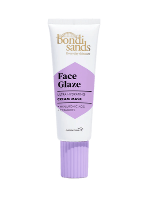 A white tube of BondiSandsEU Face Glaze Cream Mask with a purple cap and label, featuring hyaluronic acid and ceramides for hydrated, dewy skin, is displayed against a plain light background.