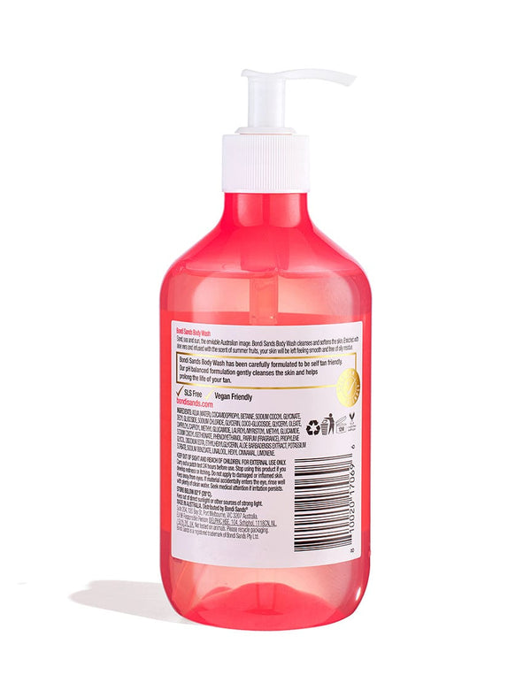A clear pink plastic pump bottle of BondiSandsEU Summer Fruits Body Wash with a white dispenser shows the back label featuring symbols for 95% natural origin, aloe vera, and vegan friendly. The bottle is set on a white background.