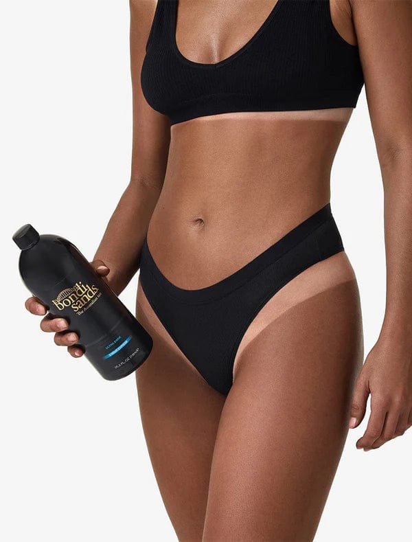 A black 1-liter bottle of BondiSandsEU Salon Solution Ultra Dark spray tan, labeled 2 Hour Express, with gold and blue accents and "The Australian tan" on the front.
