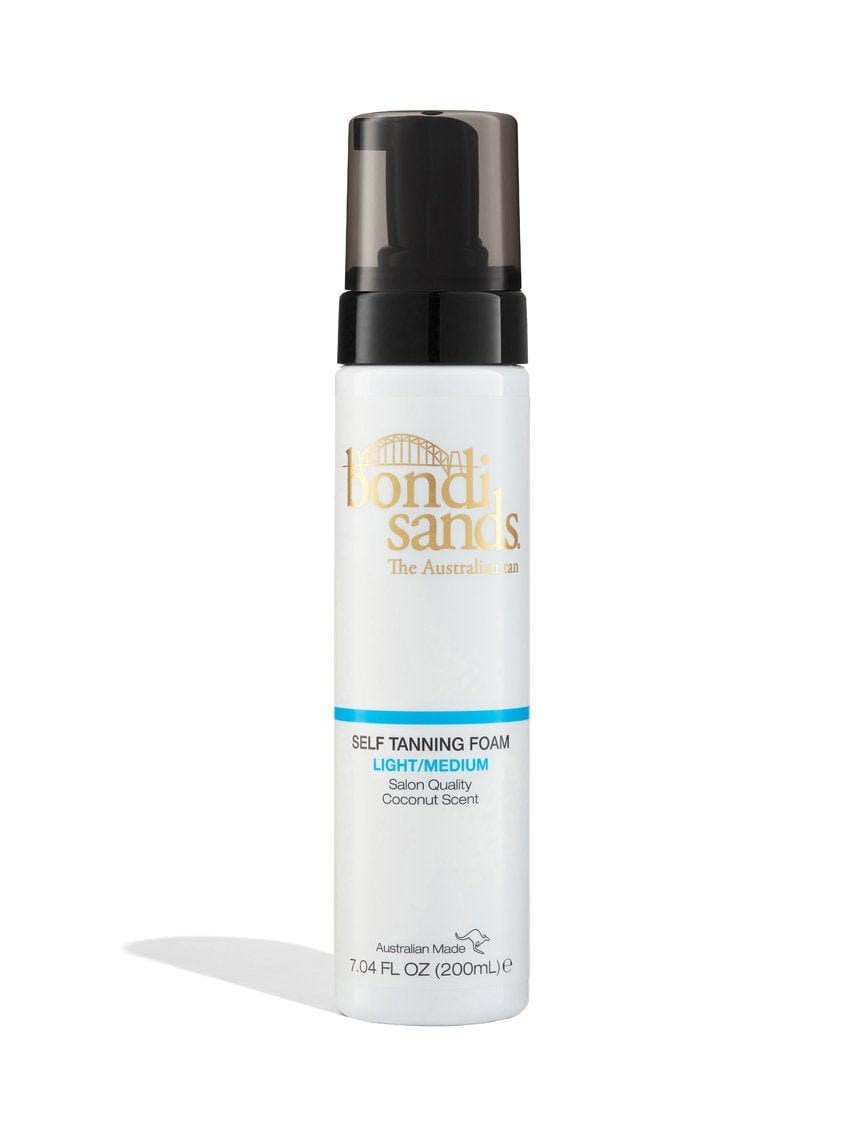 The BondiSandsEU Light/Medium Self Tanning Foam, 200 mL, comes in a white bottle with a black pump and gold, blue, and black text—ideal for a natural-looking glow.