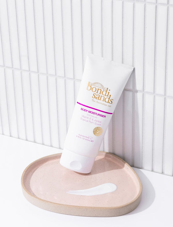 Bondi Sands Tropical Rum Scented Moisturiser Lifestyle Bathroom Image with Swatch