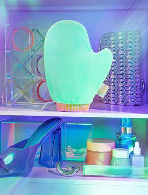 Technocolor Deluxe Self Tanning Application Mitt Lifestyle Image with Beauty Products