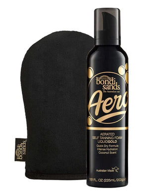 The BondiSandsEU Aero Self Tanning Foam Liquid Gold & Application Mitt Bundle is shown, featuring gold and white accents on the bottle and a coconut scent label, alongside a black mitt.